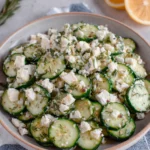 Classic Cucumber Feta Salad is a crisp, refreshing side dish made with cucumbers, feta cheese, fresh herbs, and a bright lemon dressing.