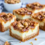 Close-up of homemade Crème Brûlée Cookie Bars topped with crunchy toffee bits, featuring a soft chewy center and golden caramelized topping on a white plate in natural kitchen lighting.