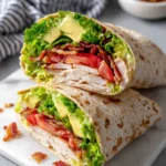 Discover the best California Turkey Club Wraps recipe made with juicy turkey, crispy bacon, creamy avocado, fresh lettuce, and tomatoes wrapped in a soft tortilla. This easy 20-minute lunch is perfect for busy weekdays, meal prep, picnics, or a light family dinner.