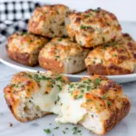 Freshly baked Mini Grilled Cheese Hawaiian Rolls with golden buttery tops, gooey melted cheddar and mozzarella cheese, served warm on a white plate in a bright home kitchen. An easy homemade appetizer perfect for parties, game day, or family snacks.