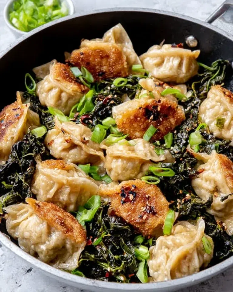 One Pan Greens and Dumplings makes a quick, comforting dinner with golden dumplings, tender greens, ginger, and chili crisp